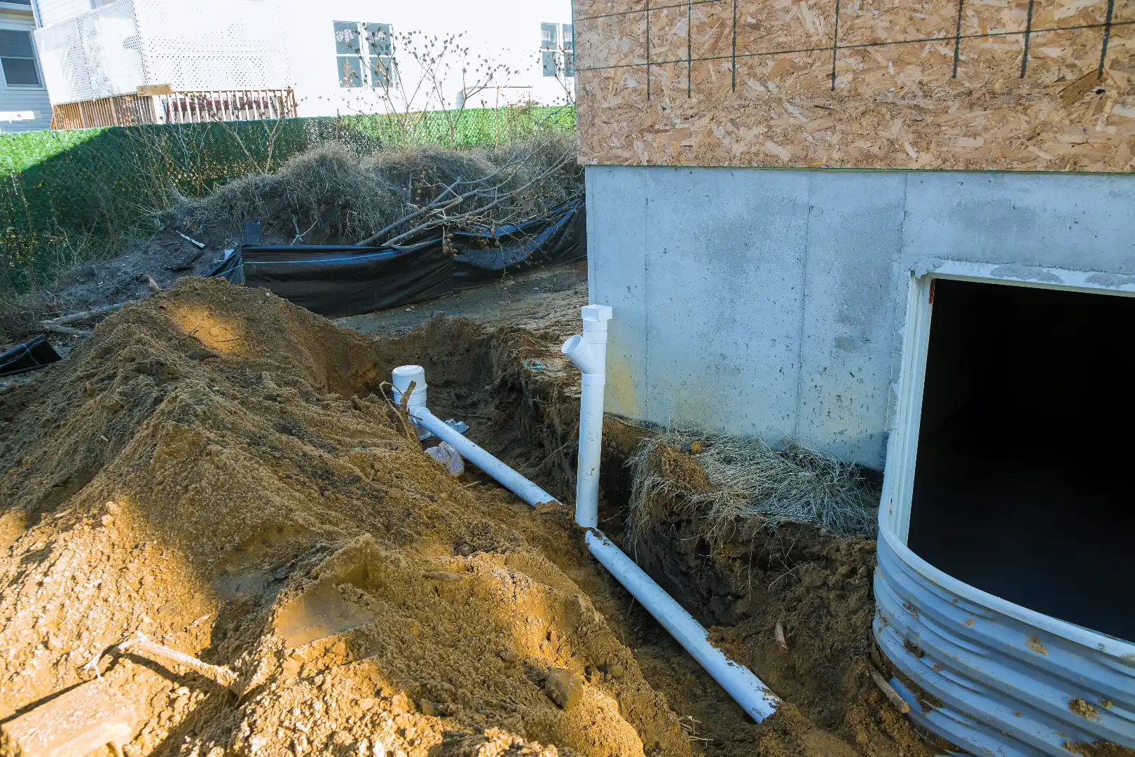 Plastic piping and drainage sump pump pipes installed around Caledon rural property