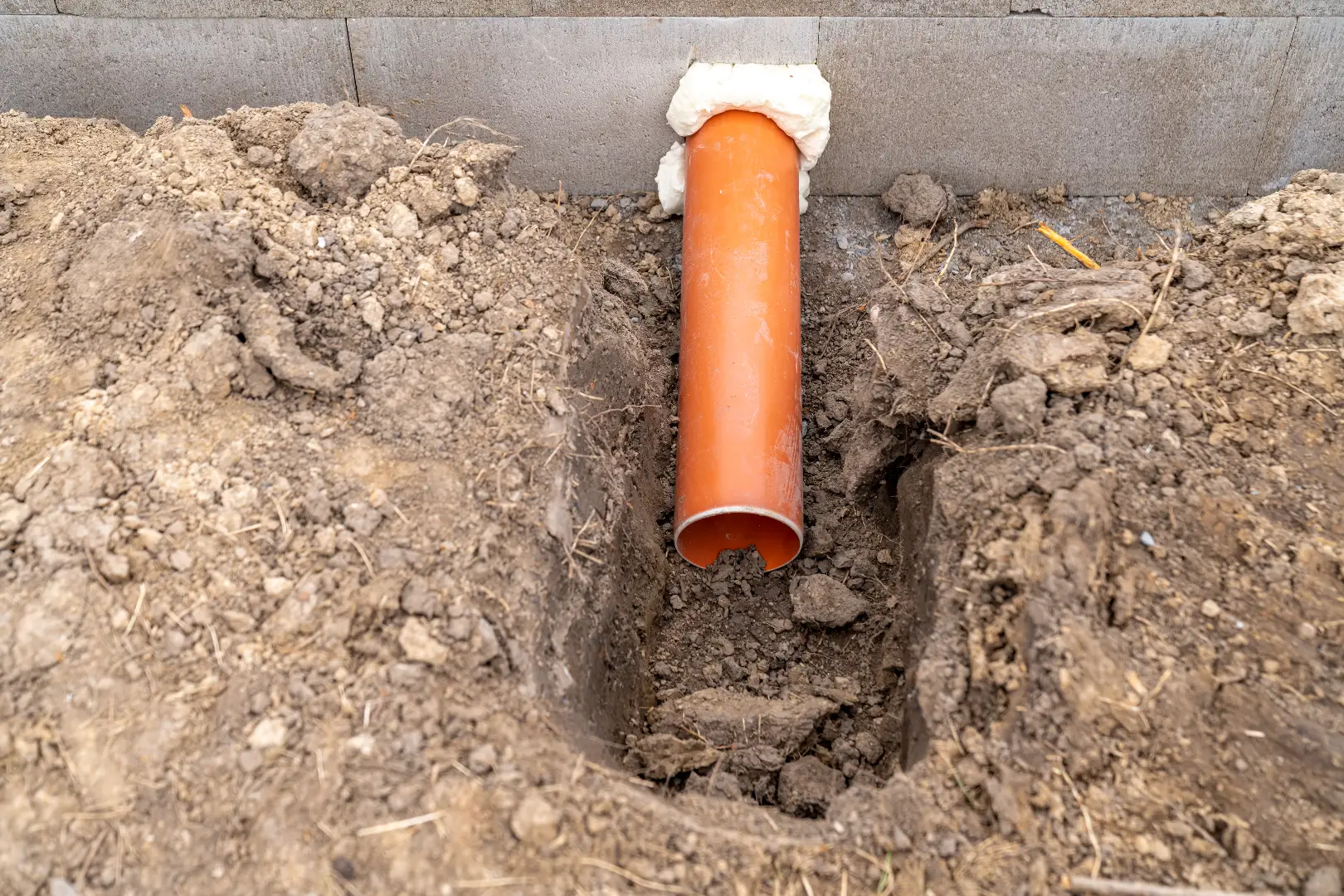 PVC sewer pipe network being installed in Richmond Hill home foundation — professional service