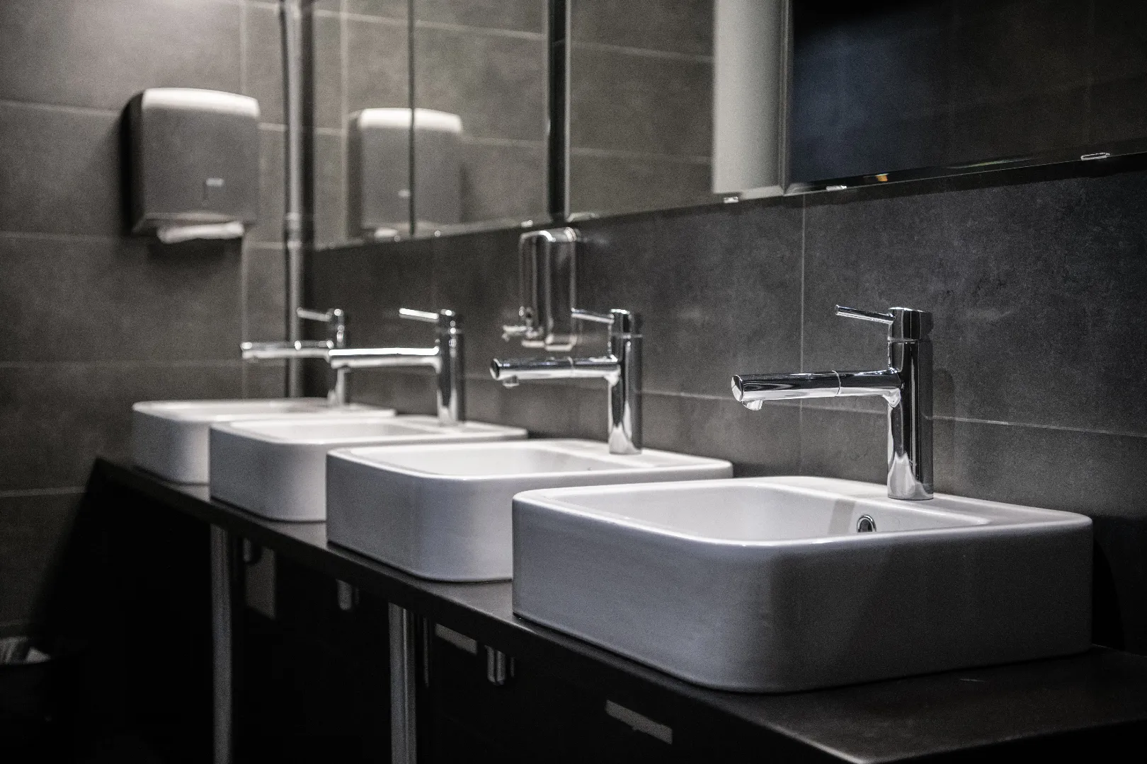 Modern commercial public bathroom renovation by licensed plumber in Toronto GTA