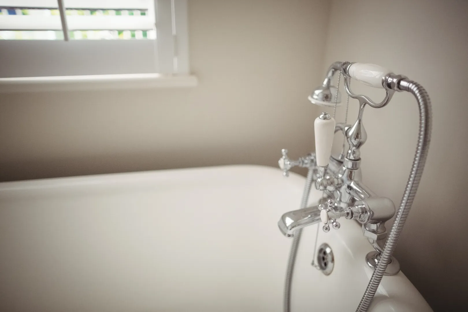 Interior view of bathtub and tap being replaced during faucet repair service in Toronto
