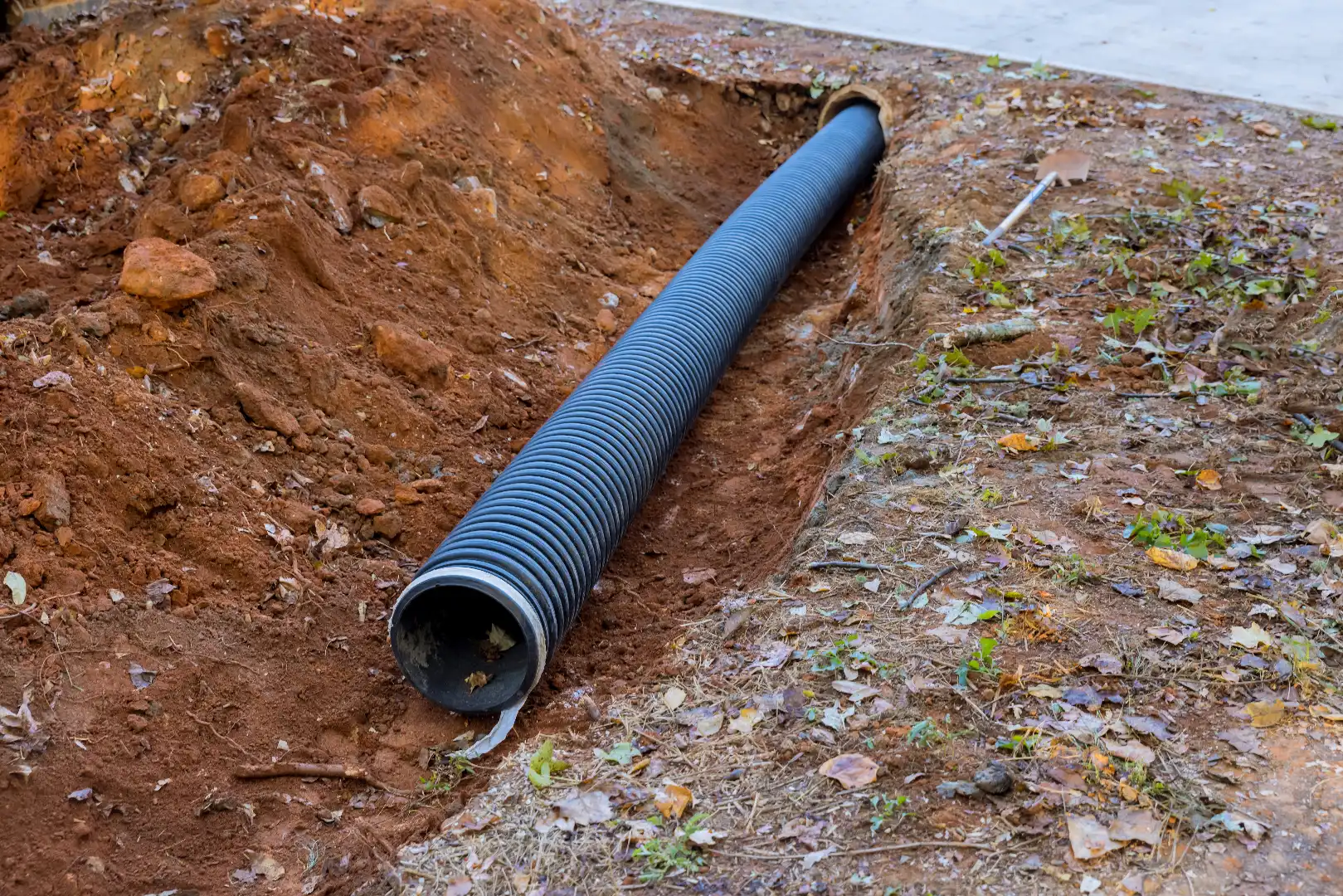PVC sewage pipes being laid underground during sewer line repair and replacement in Toronto